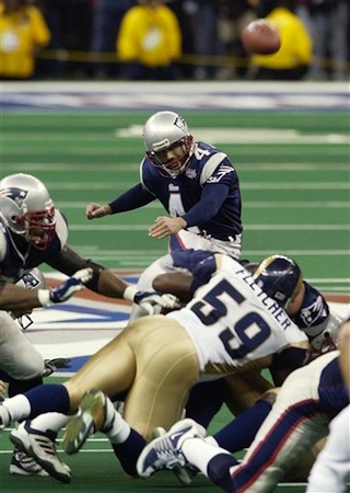 In this Sunday, Feb. 3, 2002 photo, New England Patriots kicker Adam Vinatieri kicks his game-winning 48-yard field goal in the final seconds to beat the St. Louis Rams 20-17 in Super Bowl XXXVI in New Orleans. (AP Photo/Kathy Willens, File) NFL