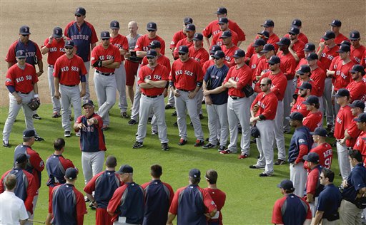 Boston Red Sox manager Bobby Valentine, center left, talks to players at the start of a baseball spring training workout on Tuesday in Fort Myers, Fla.