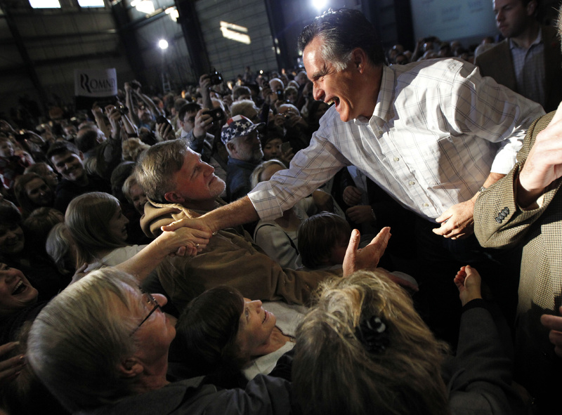 Former Massachusetts Gov. Mitt Romney greets supporters after speaking at a campaign rally in Colorado Springs, Colo., on Saturday.