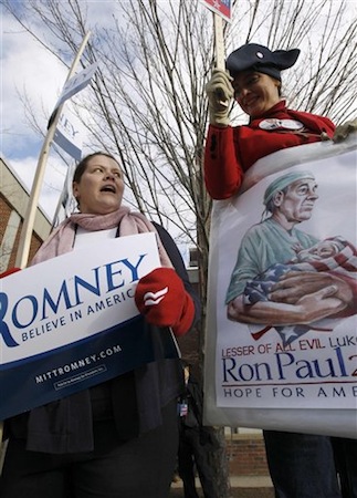 Supporters of Republican presidential candidates Mitt Romney and Ron Paul argue outside a Romney campaign event in New Hampshire. (AP Photo/Charles Dharapak)