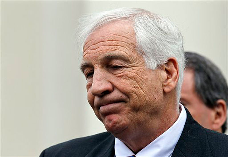 Jerry Sandusky, a former Penn State assistant football coach charged with sexually abusing boys, pauses while speaking to the media at the Centre County Courthouse after a bail hearing on Friday, Feb. 10, 2012. (AP Photo/Alex Brandon)