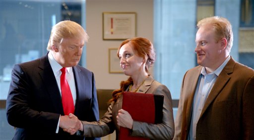 A scene from the ad "Smarter, Bolder, Faster," with a Century 21 saleswoman and real estate tycoon Donald Trump, left. The ad aired during Super Bowl on Sunday.