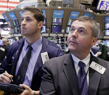 Traders Thomas Donato, left, and James Lamb watch the action at the New York Stock Exchange.