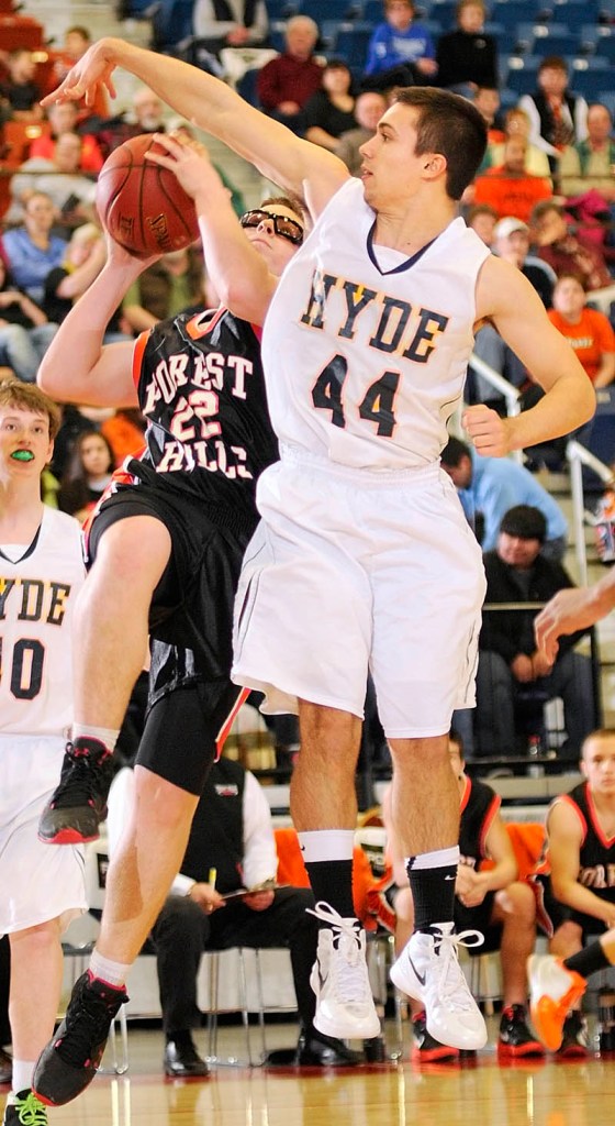 Forest Hills forward Derick Ouellette draws a foul from Hyde's Talin Rowe.