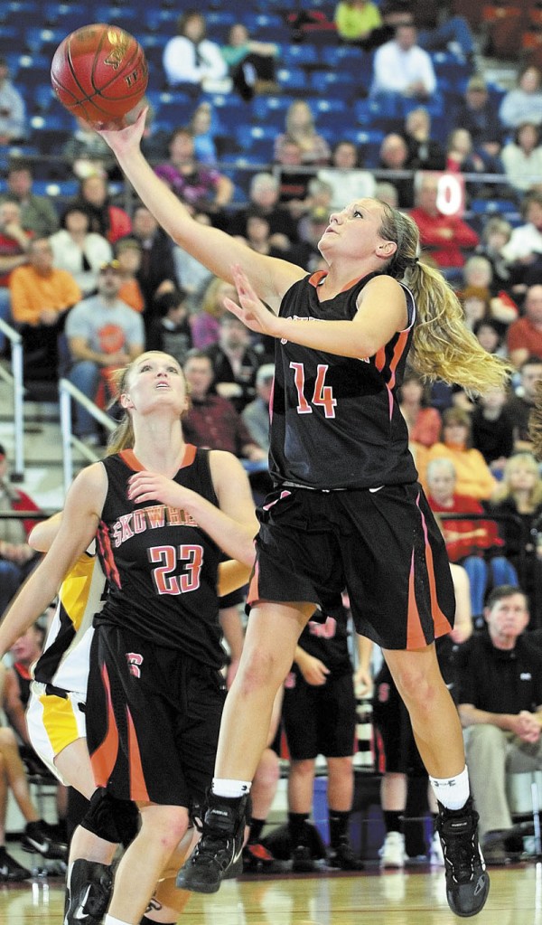 A TOUGH TASK: Skowhegan’s Amanda Johnson goes up for a shot during the Indians’ 56-55 win in overtime over Mt. Blue in the Eastern A regional quarterfinals Friday in Augusta. Johnson scored 27 points. richmond buckfield standish softball