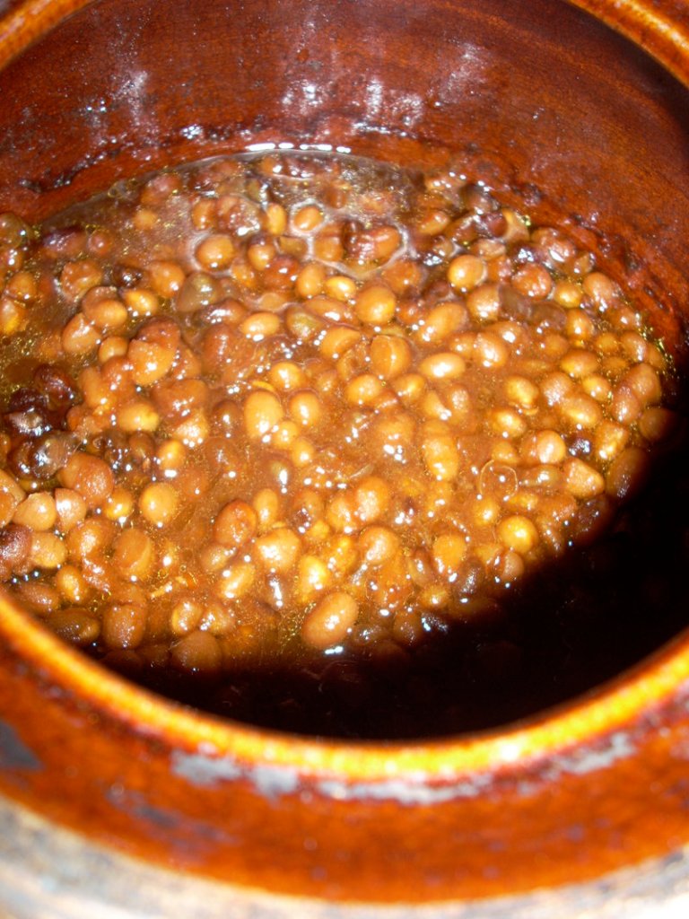 Baked beans, whether made with the traditional molasses or taking a more Latin turn, fill a home with warmth and an appetizing aroma as they bake for eight hours.
