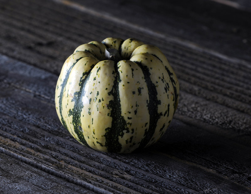 Elongated, with tender, pale yellow skin, the delicata squash has very sweet, pale orange flesh and an edible peel.