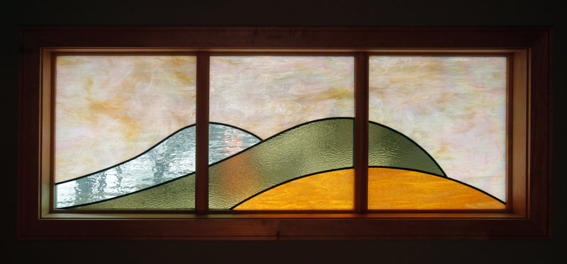 A stained-glass window in the Shaffer house also has curves meant to mimic ocean waves.
