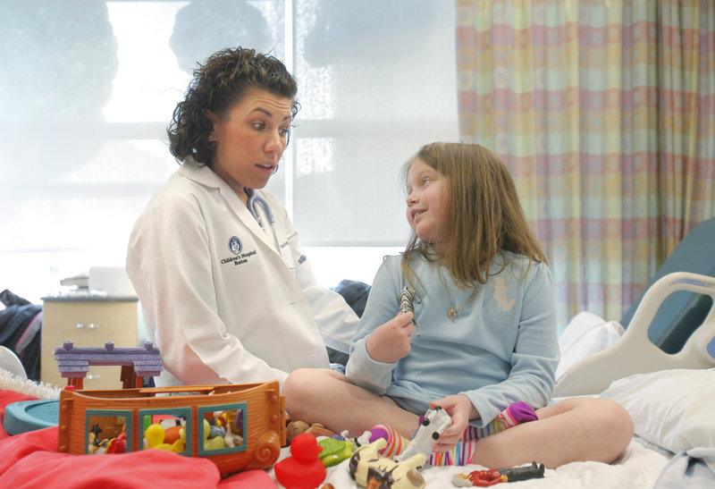 At Children’s Hospital Boston on Tuesday, Alannah Shevenell of Hollis talks with Courtney Fratto, a nurse practitioner who has been working with her for four years.