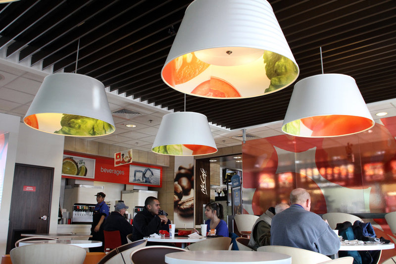 A McDonald’s in Oak Brook, Ill., has been remodeled to reflect the chain’s new look. On the design menu: flat-screen televisions, half-moon booths and more. Company officials are hoping a higher-end look for its stores will translate into increased sales.