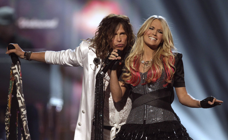 Steven Tyler says once he met Carrie Underwood “it was all over after that, once I looked into her eyes ... I loved singing with her.”