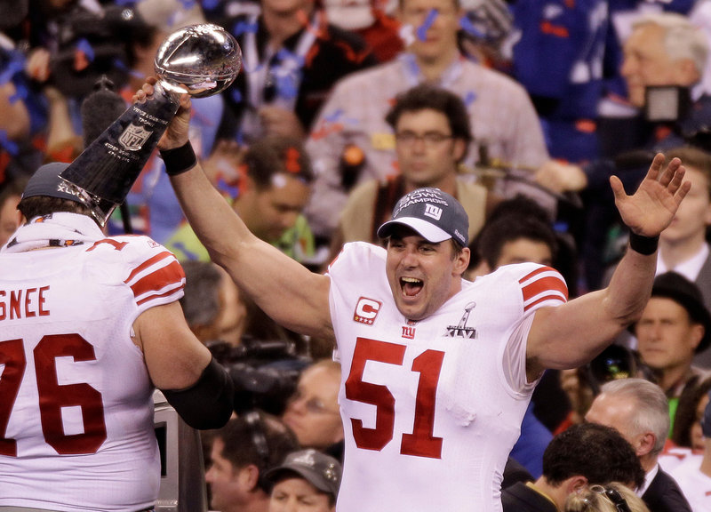 Zak DeOssie, the long snapper for the New York Giants, had his hand on something other than the ball Sunday night. He got to clutch the Lombardi Trophy after the 21-17 victory against the New England Patriots in the Super Bowl at Indianapolis.