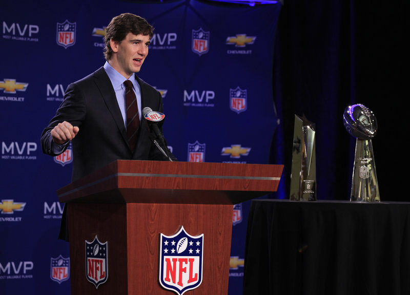 Giants quarterback Eli Manning speaks during a news conference Monday after Super Bowl XLVI in Indianapolis. Manning, who completed 30 of 40 passes for 296 yards and a touchdown, was on hand to collect his Most Valuable Player award.