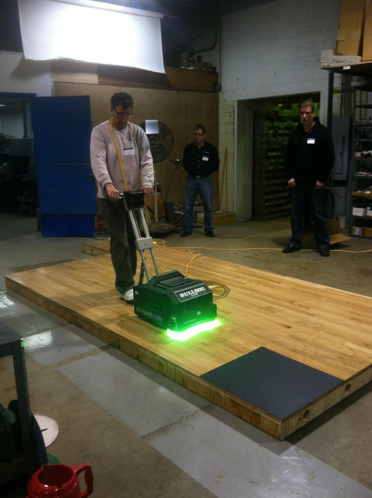 The topic of one demonstration at the home show: A relatively new technology that uses ultraviolet light to cure newly finished hardwood floors. The UV light is rolled across a floor and hardens it instantly.