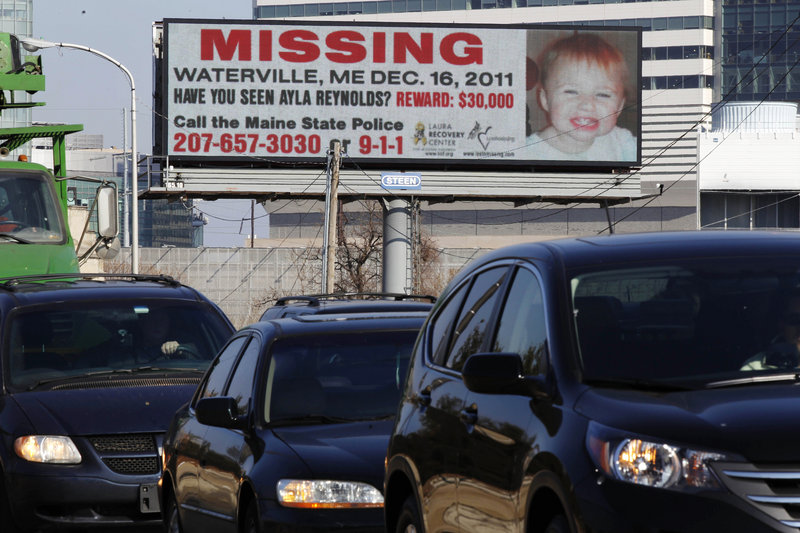 Cars pass an electronic billboard with an image of missing Maine toddler Ayla Reynolds on Tuesday in Philadelphia. There are eight billboards in Philadelphia and one in New Jersey.