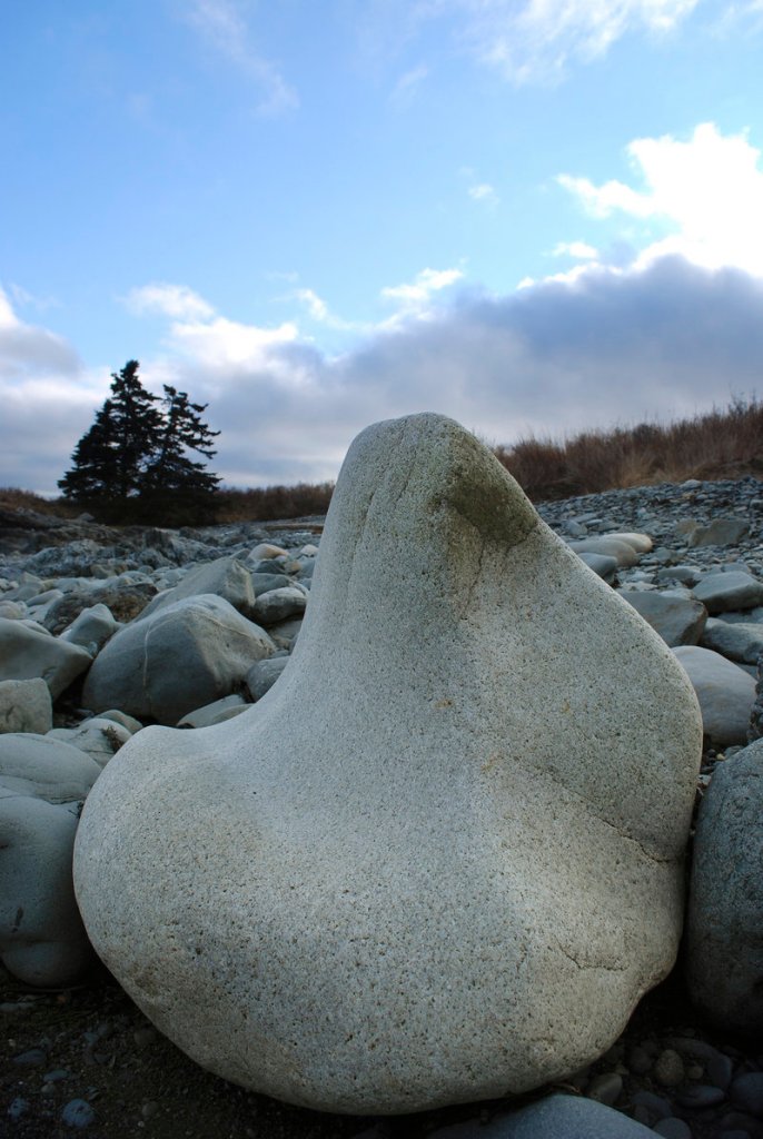 The beaches at Bog Brook Cove are formed in round and beautiful shapes, like this boulder that is shaped like a bench – and it serves as a nice one.