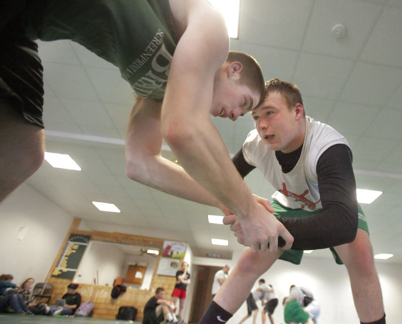 Josh Andrews, right, grapples with Massabesic teammate David Norton during a practice this week. Andrews is 25-2 this season.