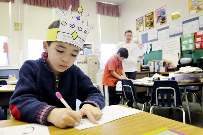 Isaac Steward, 7, fills out a worksheet during Debbie Waugh’s second-grade class at Greater Portland Christian School in South Portland last week. State education officials say that many religious schools wouldn’t have to follow the Maine Learning Results to qualify for public funding, though meeting other criteria might be too expensive and time-consuming to make it worthwhile.