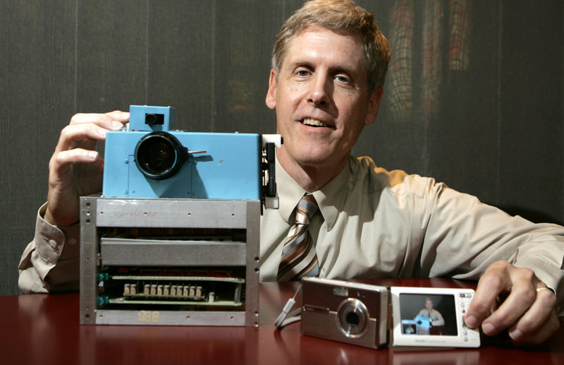 Steven Sasson, then Eastman Kodak Co. project manager, shows the prototype digital camera he built in 1975 next to a Kodak EasyShare One at Kodak headquarters in Rochester, N.Y., in 2005.