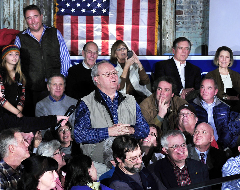 Tim Thompson of Cape Elizabeth poses a question to Mitt Romney during the GOP candidate’s visit to Portland on Friday. Romney is also expected to attend the Portland caucus today.