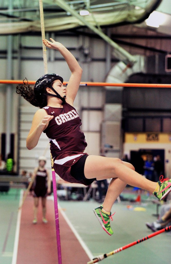 Nina Oberg of Greely clears the bar during the pole vault Friday night at the Western Maine Conference meet in Gorham. The event was won by Oberg’s teammate, Abby Bonnevie, and the Rangers also won the team title.