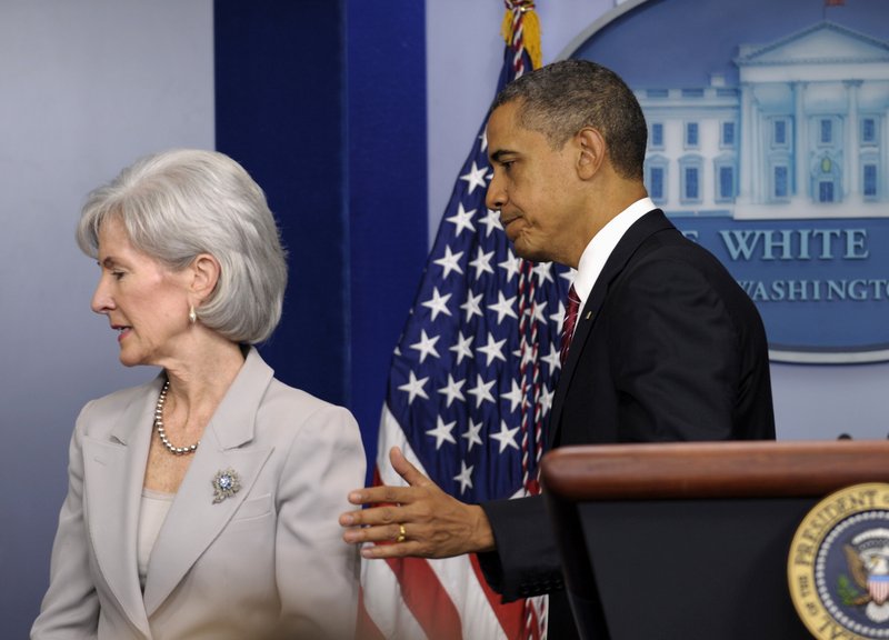 President Obama and Health and Human Services Secretary Kathleen Sebelius leave their news conference Friday.