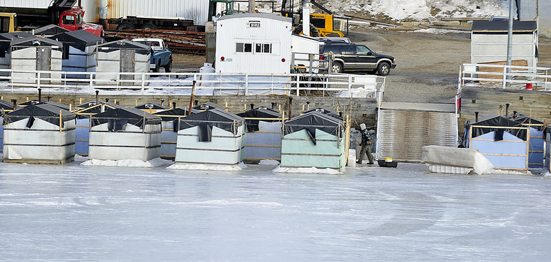 Ice fishing shacks are stored Monday at Worthing’s Smelt Camp on the Kennebec River in Randolph, where selectmen voted last June to charge a $15 fee for each smelting shack on the ice along the town's river frontage.