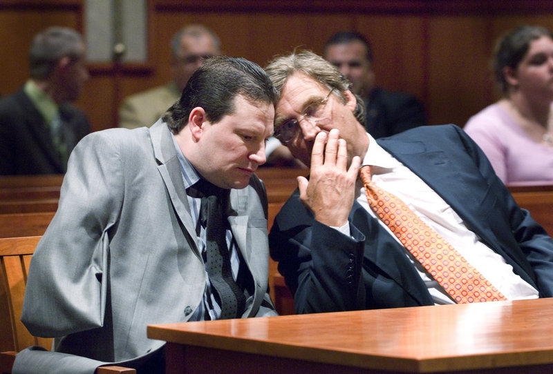 Douglas Tenczar, left, confers with his attorney, Thomas Hallett, during court proceedings in August 2009 in connection with a 2008 road rage incident. On Monday, Tenczar filed suit, alleging that the deputies who investigated the road rage incident used excessive force.