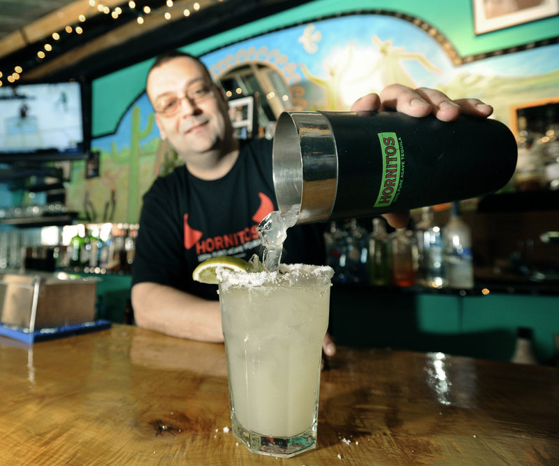 General manager and bartender Randy Ouellette pours a Mesa Verde margarita.