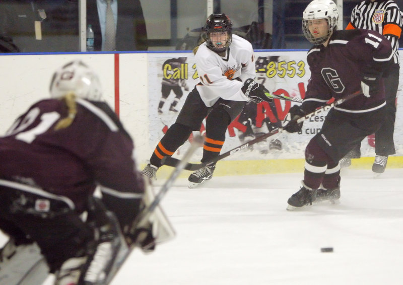 Gillian Ford of Brunswick watches her shot head toward the net against Greely. Ford had one of Brunswick’s goals.