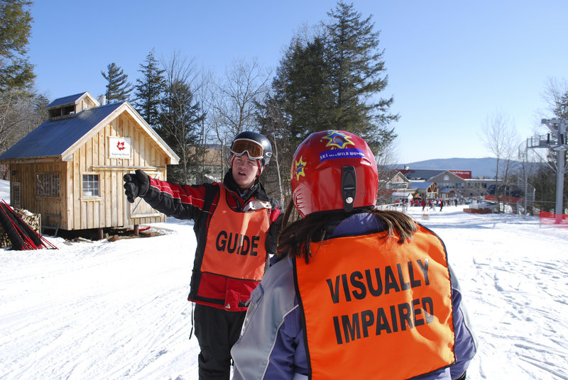Liam Gillis, a Gould Academy junior, helps instruct a visually impaired skier at Sunday River. Gillis helped Gould Academy set up the portion of its ski instructor program that works with Maine Adaptive Sport. Gould’s ski instructor program has taught local children for 25 years.