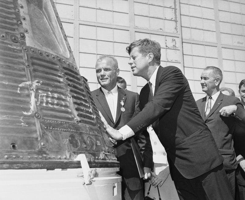Astronaut John Glenn, left, and President John F. Kennedy inspect the Friendship 7 capsule that Glenn rode into orbit in this Feb. 23, 1962, photo.