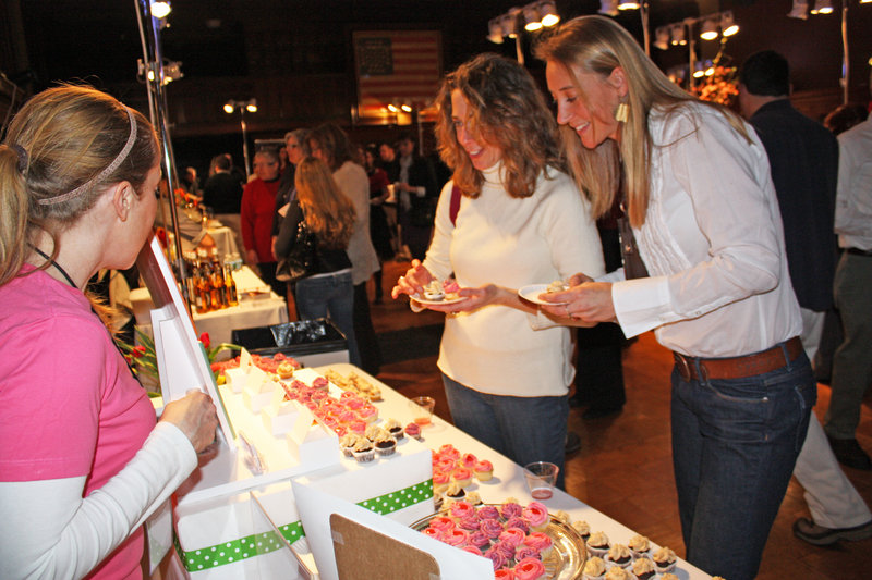 Stephanie O’Neil of Tulips Cupcakery shares samples with Francesca Kerr and Patience Cleveland at last year’s Signature Event.
