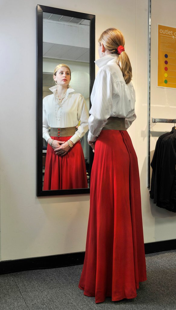 A model wears the outfit that designer Jill McGowan would choose for close, a white poet's shirt paired with a vintage Valentino skirt.