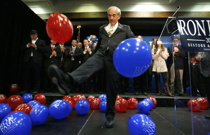 Rep. Ron Paul kicks balloons after speaking to supporters in Portland last Saturday after his loss in the Maine caucuses to Mitt Romney. Paul was reported the winner in the Portland caucus last weekend, but the recount gives the win to Romney.