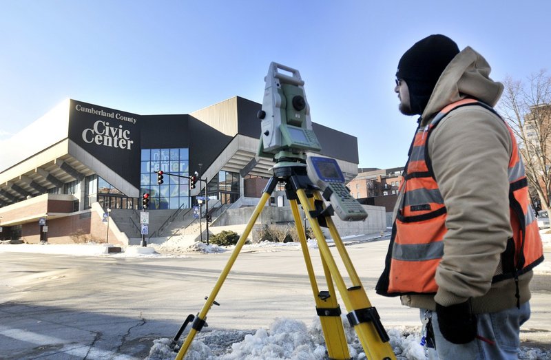 Glenn Griswold of Shyka, Sheppard & Garster Land Surveyors surveys property around the civic center Jan. 18. A consultant favors doing much of the renovation work during the summer and working around the event schedule the rest of the year.