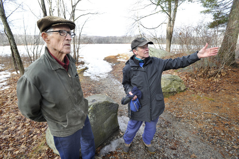Ralph Johnston of Windham and Julie Motherwell of Falmouth respectfully differ over whether to improve access for bigger boats to use Highland Lake.