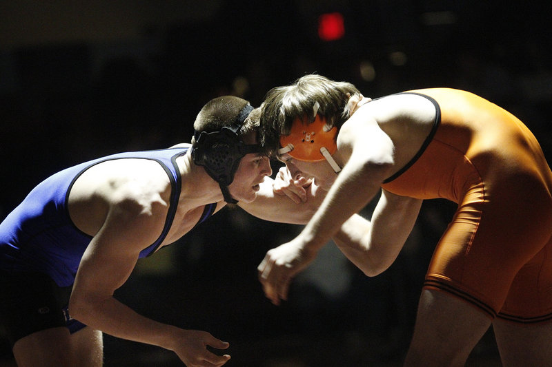 Graham Strondak, left, of Westbrook faces off with Christian Jackson of Skowhegan in the 160-pound class during the Class A state championships at Windham on Saturday. Strondak won the match. 3-1.