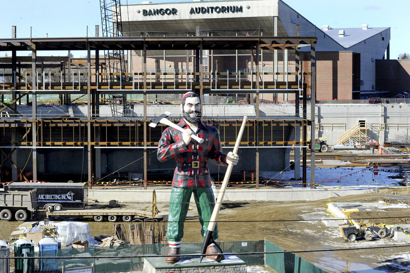 Bangor’s iconic Paul Bunyan statue stands in front of the construction site of a new $65 million arena, which will replace Bangor Auditorium, seen at rear. Scheduled to open in 2013, the arena presents new competition for Portland in attracting touring shows.