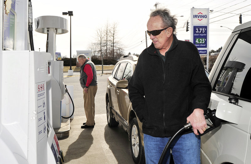 Jim Gorman fills up at an Irving in Falmouth where regular gas cost $3.75 a gallon Tuesday. Price increases are being driven by concern over Iran, which has threatened to cut off a key oil shipping route.
