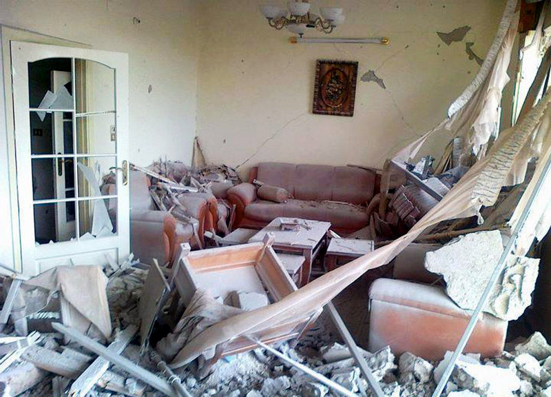 An image taken Monday by a citizen journalist and provided by a Syrian opposition group depicts damage done to a home in Homs by Syrian government forces shelling.