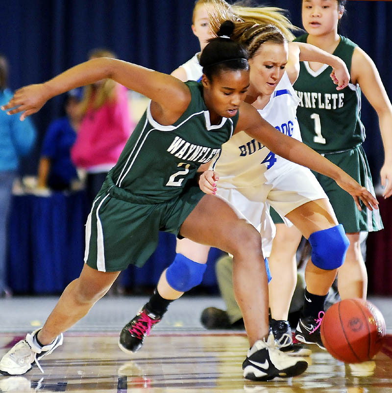 Rhiannan Jackson, left, of Waynflete looks to beat Melissa White of Madison to a loose ball during their Western Class A quarterfinal at the Augusta Civic Center. Seventh-seeded Waynflete came away with a 56-39 win.