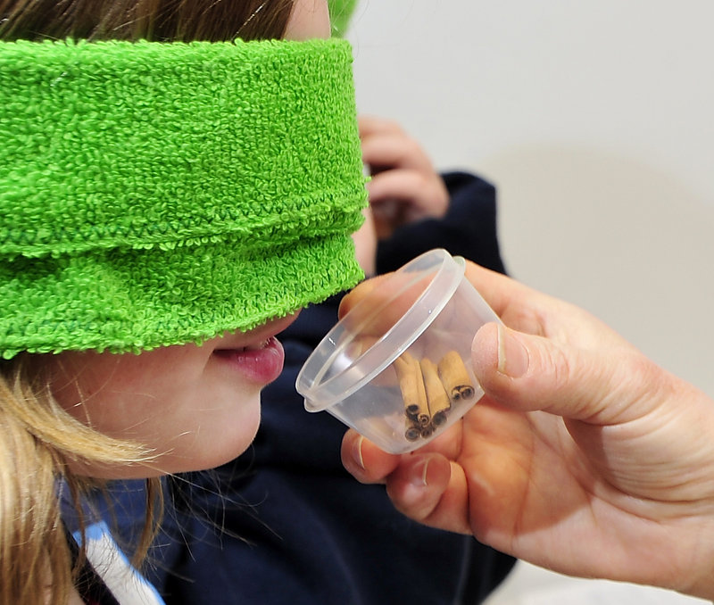 Edie Hayden-Hunt, 10, of Pownal guesses what spice she is smelling as part of a pickle lab Wednesday. The educational program will be offered again during April school vacation.