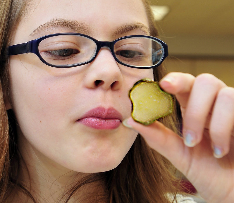 Tabitha Sabans, 10, of Pownal learns about the importance of observation in the science of food identification and preservation during a “pickle lab” on Wednesday at the University of Maine Regional Learning Center at Tidewater Farm in Falmouth.