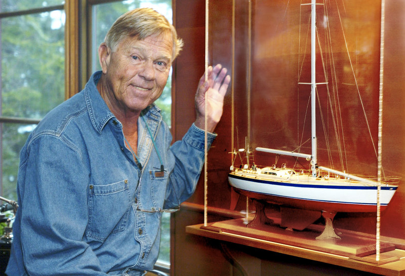 Dodge Morgan stands next to a model of his boat, American Promise. He sailed the boat around the world solo 26 years ago. The Maine businessman died in 2010 at the age of 78.