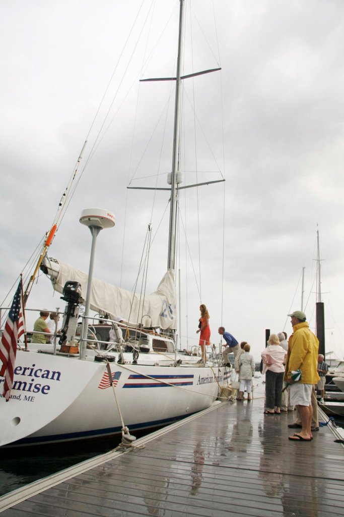 Visitors board Dodge Morgan’s American Promise in August 2011 during a special Portland ceremony that paid tribute to Morgan on the 25th anniversary of his solo voyage around the world. The boat is now tied up at a Kittery marina.