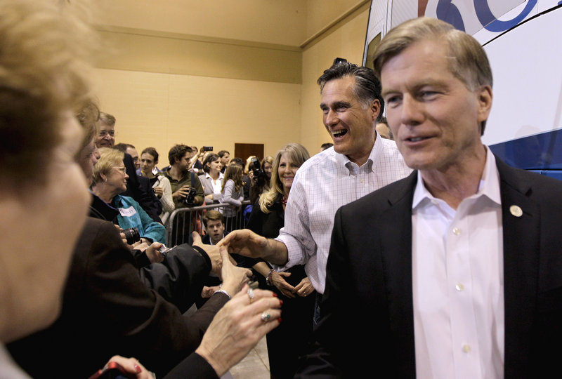 Virginia Gov. Bob McDonnell, right, shown at a January rally for Mitt Romney, withdrew his support of an anti-abortion proposal that would have required an invasive ultrasound.