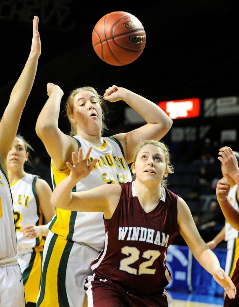 The ball bounces free in front of Lauren Coughlin of Windham and Kathryn Liziewski of McAuley. McAuley won, 49-33.
