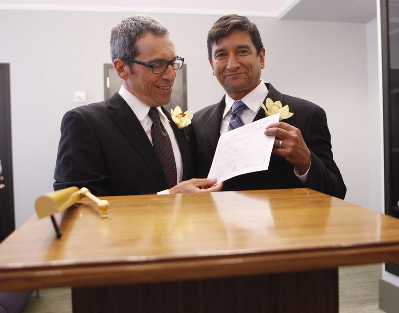 When New York’s same-sex law went into effect in July 2011, hundreds of couples legally tied the knot, including Daniel Hernandez, right, and Nevin Cohen, shown holding their wedding certificate in New York City. Increasingly, courts and legislatures are saying same-sex couples shouldn’t be treated differently than opposite-sex couples.