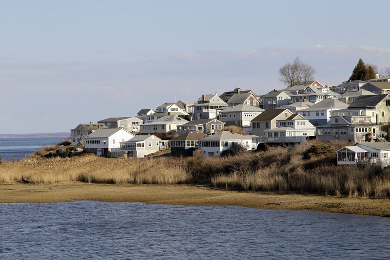 Houses are shown on Little Neck in Ipswich, Mass. The dying wish of William Payne, one of the state’s earliest settlers, created the nation’s oldest charitable trust and eventually led tenants to build 167 cottages on this land he left for the seaside city.